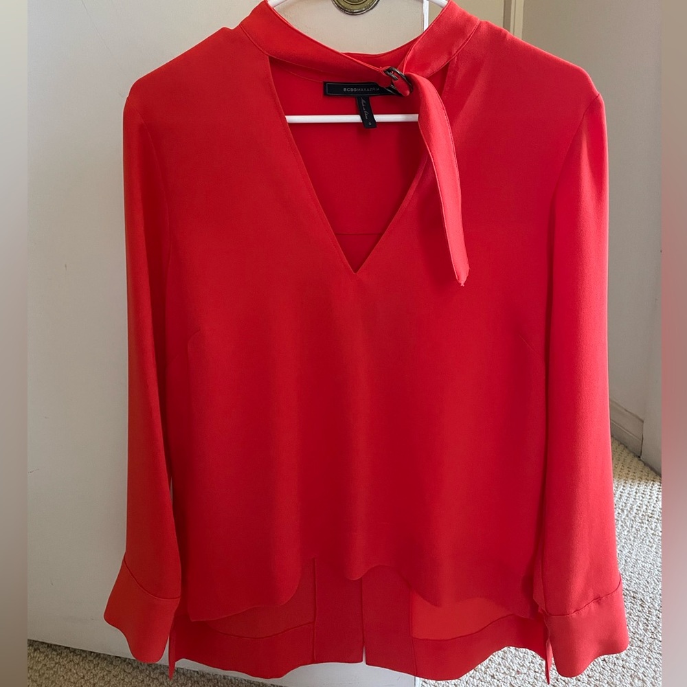 Beautiful red/dark orange blouse from BCBG. Perfect condition!